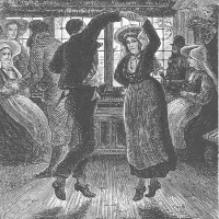 A man and a woman dancing in a group