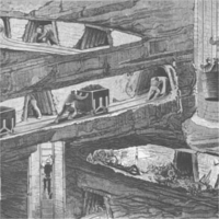 Figures working in a mine, pushing carts