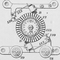 Line drawing showing a circular segmented wheel at the center, surrounded by four angled mechanical parts with numbered labels.